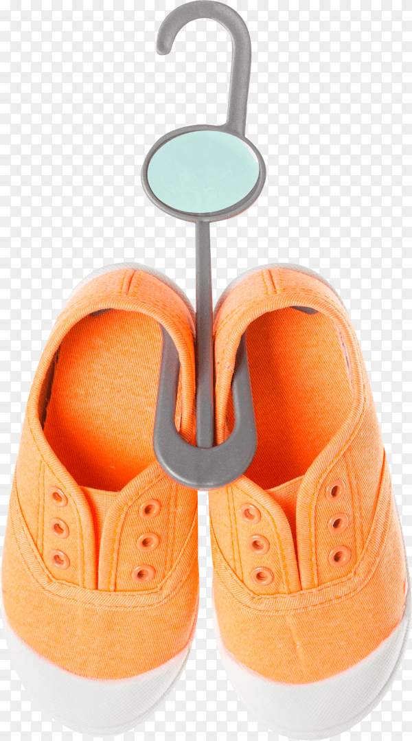 Baby girl orange sneakers on plastic hanger on transparent background PNG
